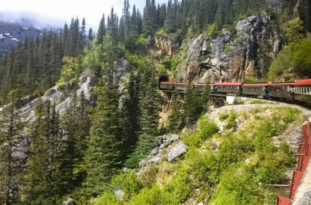 White Pass Railway train climbing alpine scenery near Skagway Alaska